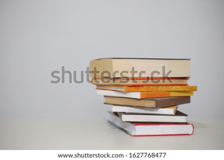 Stack of Books on the table with white background

