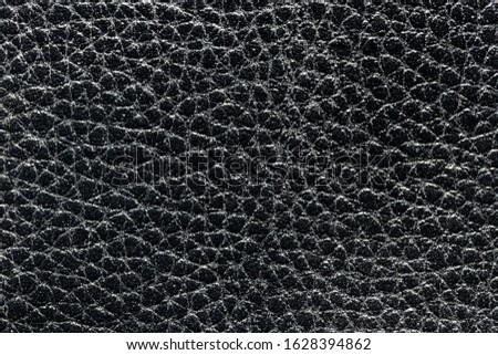 Black natural leather texture. Abstract backdrop for design.