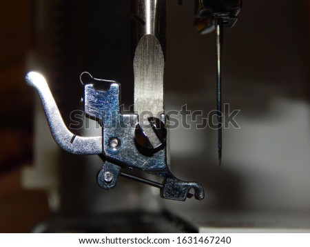 Sewing machine, foot holder and needle close-up               