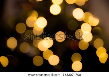 A beautiful shot of golden bokeh lights at night