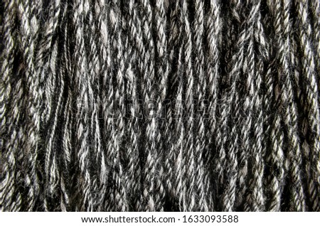 The texture of natural coarse wool yarn. Close-upн