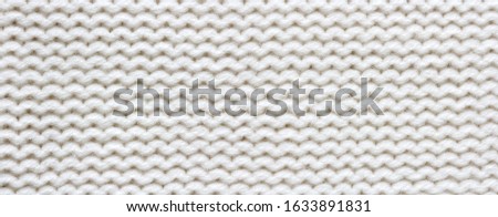 Knitted white fabric texture, reverse stockinette stitch, macro