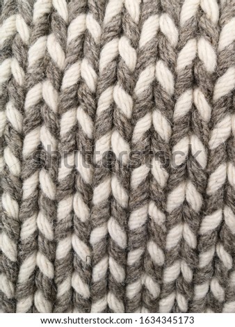 Winter Sweater Design. Grey knitting wool texture background. knitted fabric texture.