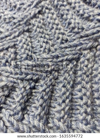 grey-blue knitted beret texture close-up