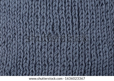 
large knitting, gray knitted background