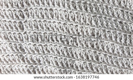 Light gray knitted texture, fiber photo background.