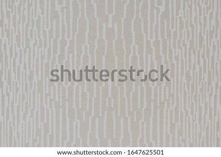 Irregular vertical strips forming an abstract background with gray patterns