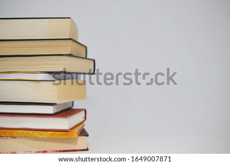 Stack of Books on the table with white background