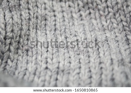 Closeup of grey woolen pullover texture 
