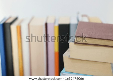 Stack of Books on the table with white background