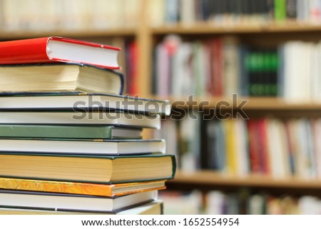 Stack of Books on the table in library