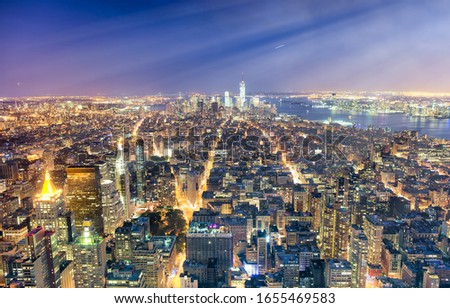 New York City, USA. Night aerial view of Midtown and Downtown Manhattan skyscrapers from a high viewpoint.