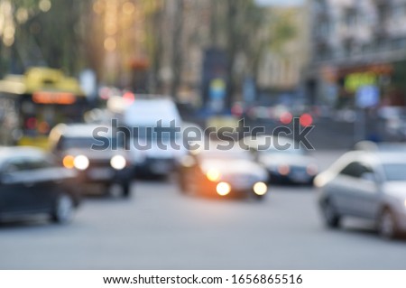 Blurred blurry soft focus background, busy downtown street with cars and lights, urban city life concept.