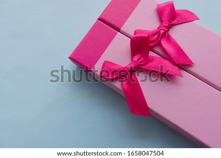 Gift box with a bow. Pink tone