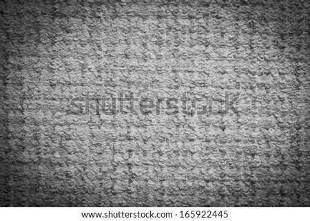 Gray carpet background. Textile texture. Light vignette