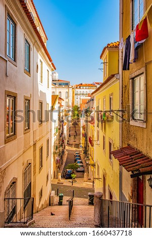 Narrow, authentic street of Lisbon, Portugal.