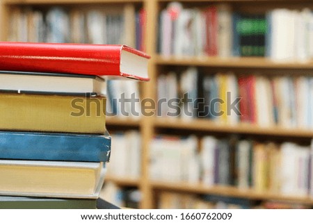 Stack of Books on the table in library