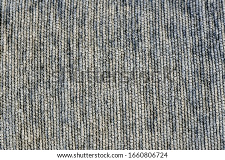 Texture of coarse fabric. Blue textile background with grey tint