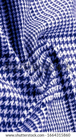 Background texture, pattern. The fabric is thick, warm with a checkered pattern, blue. Stop. You made the right choice by purchasing this photo, your design will be great with this image.