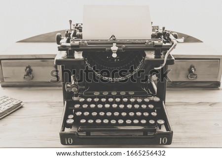 Vintage typewriter with clean paper