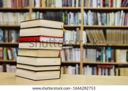 Stack of Books on the table in library

