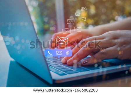 Contact us or Customer support hotline people connect. Businessman using a laptop computer with the (email, call phone, mail) icons.