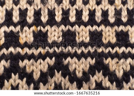 Close-up of knitted fabric, blue and white, natural colors. 