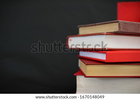 Red books on black background_2