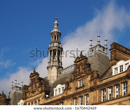 ornate stone towers and domes on the roof of leeds city market a historical building in west yorkshire england