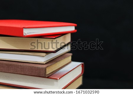 Stack of books in dark