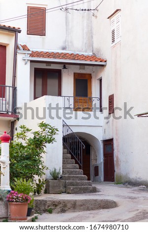 Small patio with steps to a house in Croatia.