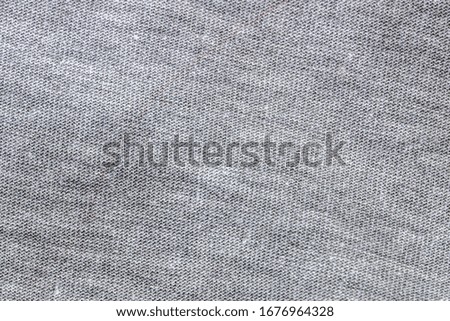 Gray fabric texture, background of woolen yarn.