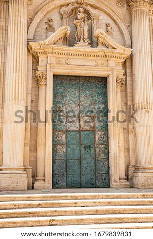 Beautiful old door of one of the cathedrals in Lecce (Puglia, Italy)
