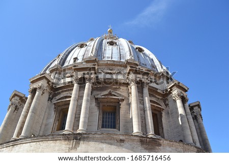 Close-up photo of a dome of St. Peter's Cathedral in Rome, Italy.