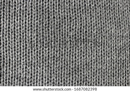 Close-up of knitted wool texture, background, gray