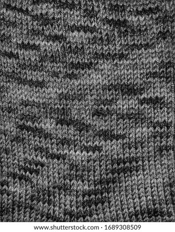 knitted grey fabric with speckles
