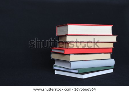 Stack of books on black