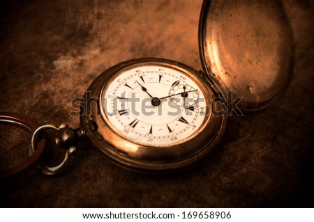 Old vintage pocket watch.Selective focus in the middle of watch