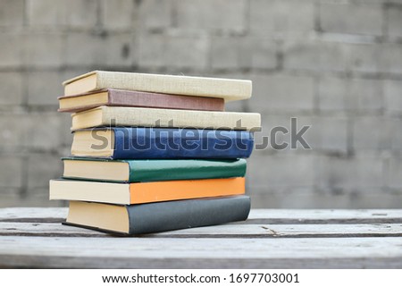 Books on a wooden box, books in an industrial setting