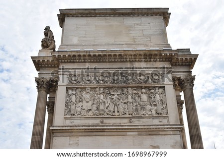 View of the upper relief of the Arc de Triomphe de Marseille (Porte d'Aix), Occitanie, France. Represents the coats of arms of the French Republic
