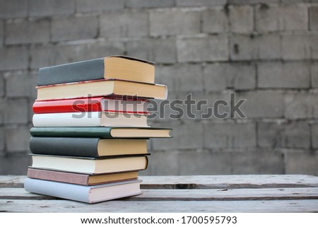 Stack of books on a wooden box