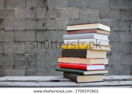 Stack of books on a wooden box