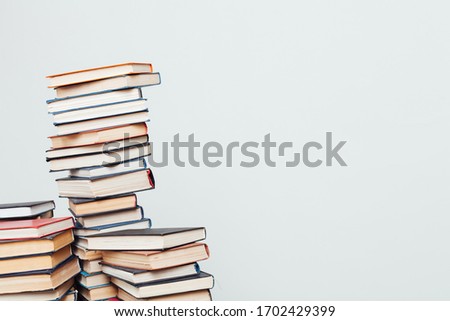 lots of stacks of educational books to teach in the library on a white background