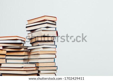 lots of stacks of educational books to teach in the library on a white background