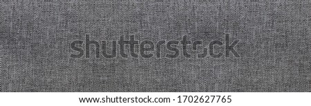 Wide gray texture background, empty smooth seamless cloth pattern. Soft plain grey background, empty natural material wallpaper. Blank cloth structure wallpaper, elongated banner backdrop