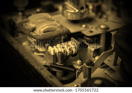 Old reel tape recorder. Detailed view of the internal structure of an analog tape recorder. Focus on a mechanical magnetic tape counter. Eye level shooting. Selective focus.