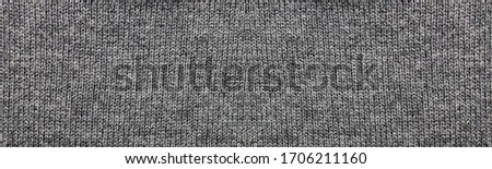 Gray texture fabric background of empty seamless woven cloth pattern. Blank casual backdrop design of pale dark gray textured material, template banner or horizontal wallpaper