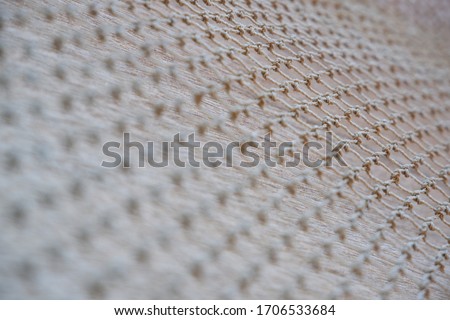 The mesh background is made of white nylon No 1.