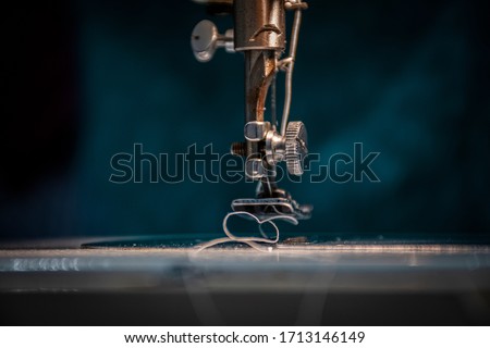 Enlarged view of a working sewing machine