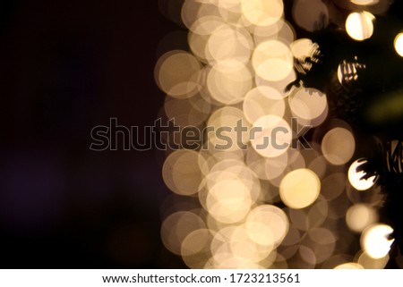 blurred golden circles of lights. defocused lights of festive garland